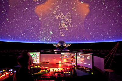 David Bush worked the console of the planetarium's projection system, showing Orion. (Photo credit: Michael Kirby Smith for the New York Times)
