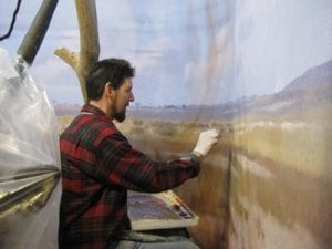 Sean Murtha creates a new backgorund painting of the African savanna