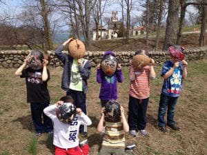 Kids show masks they made at the Vanderbilt Kids show masks they made at the Vanderbilt