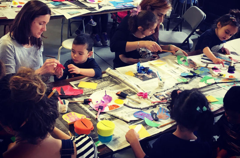 Mothers and children work on creative projects