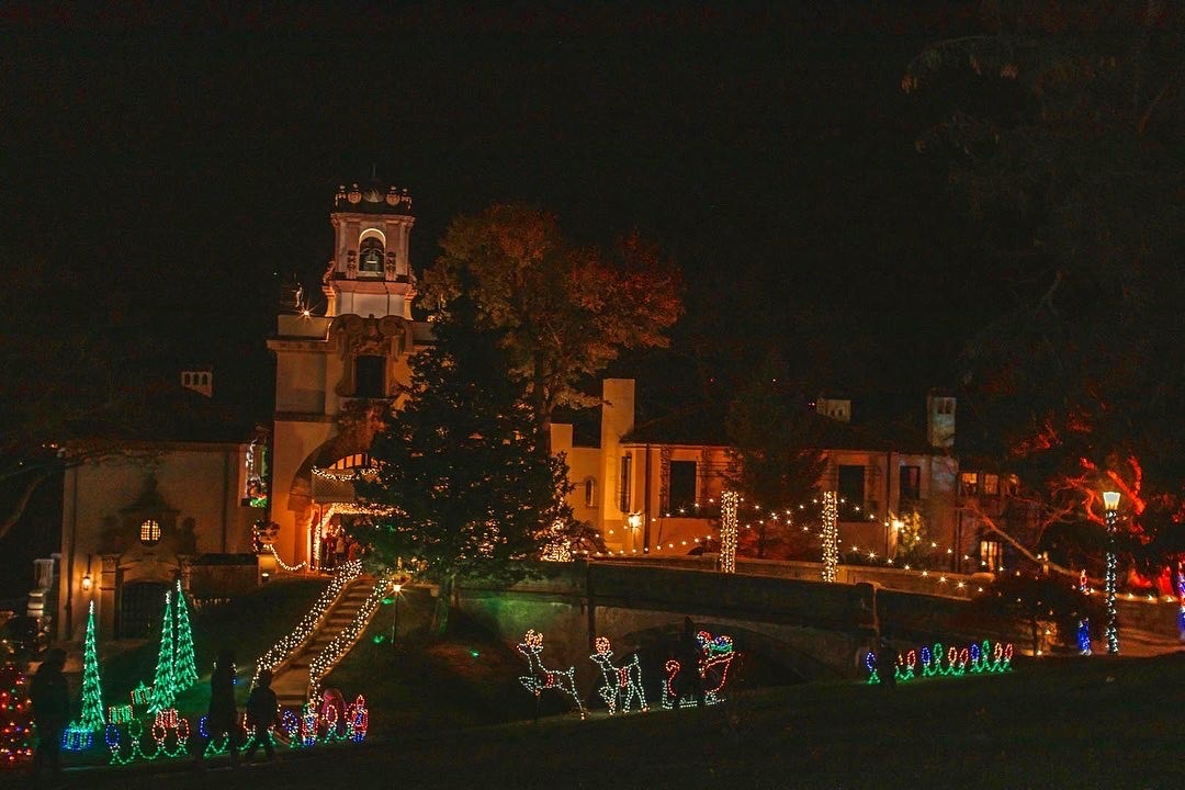 an image of the vanderbilt at night, surrounded by holiday lights