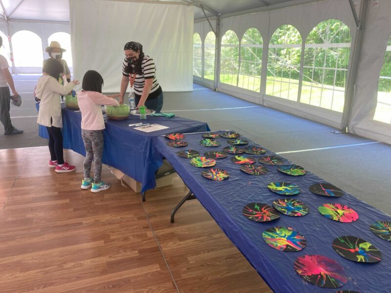 Visitors participating in a STEM activity with an Astronomy Educator.