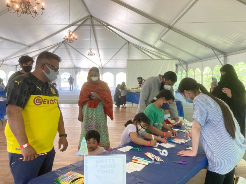 Visitors participating in a STEM activity with an Astronomy Educator.