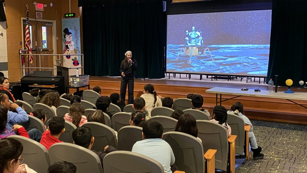 A Reichert Planetarium educator presenting an interactive astronomy program to students
